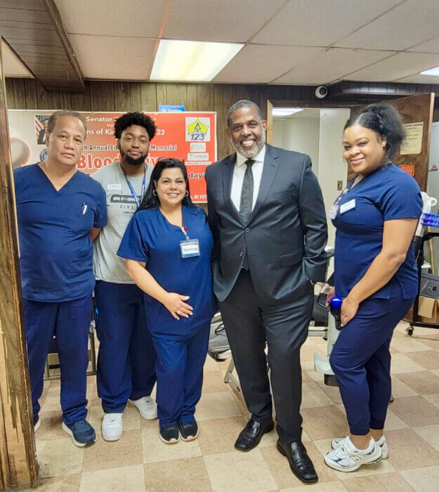 Sen. Kevin Parker, fourth from left, poses with medical personnel during the 5th Annual Edward Swire Memorial Blood Drive at Vanderveer Park United Methodist Church, on Sept.23.