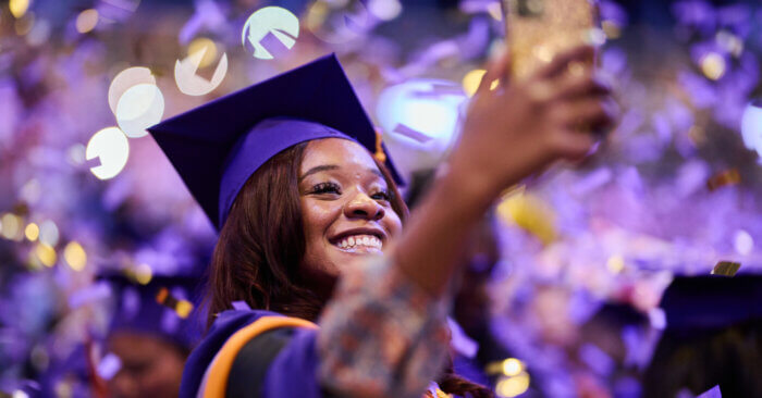 A Hunter College graduate during her graduation ceremony.