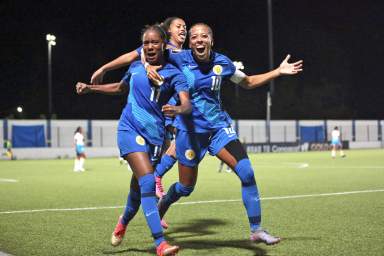 WILEMSTAD, CURAÇAO. OCT. 29: Taisha Hansen #11 celebrates her goal with Kadisha Martina #10 of Curacao during the League C Group D match between Curacao vs Anguilla in the Concacaf Road to Gold Cup held at the Stadion Rignaal Jean Francisca, Wilemstad, Curazao.