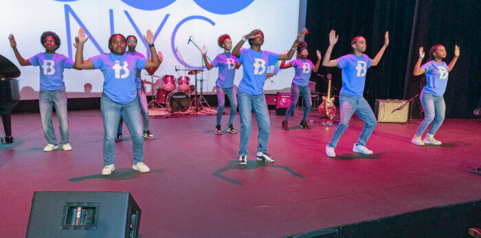 A group of students performing a dance routine. 