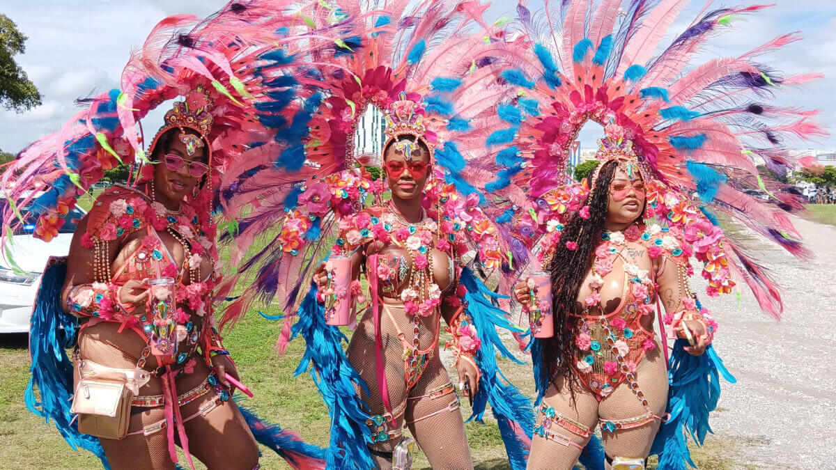Masqueraders of Euphoria Mas strike a pose for Caribbean Life in mesmerizing colorful costumes on the Miami-Dade County Fairgrounds during the 2023 Caribbean Carnival.