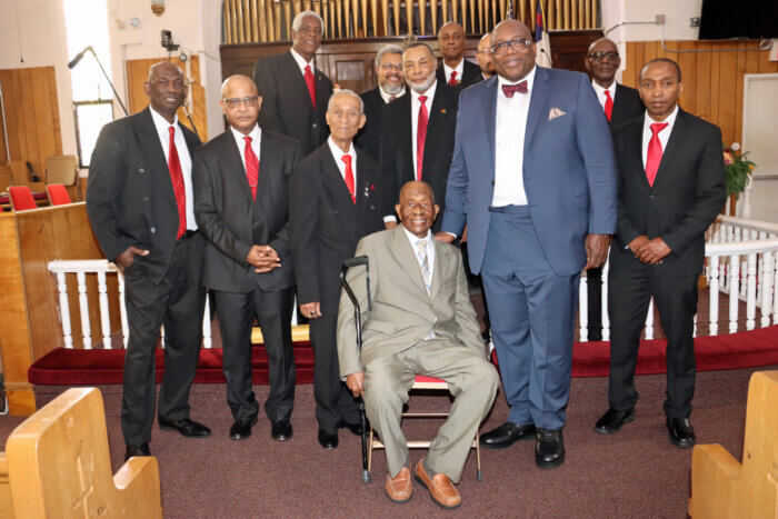 95-year-old Bro. Shaphat Jack, seated, with Rev. Dr. Wilber A. Whitehurst, Jr., second from right, front row, and United Methodist Men.
