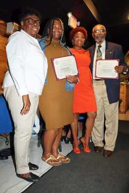 Councilmember Mercedes Narcisse, third from left, presents certificates to two Lions, flanked by Brooklyn Canarsie Lions President Jean Joseph, left, in July.