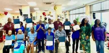 Participants of a Diabetes Self-Management class at Sundance Social Adult Day Center pose after a graduation ceremony.