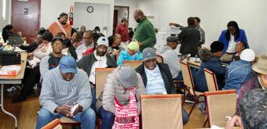 Scores of Guyanese packed St. Gabriel's Church Annex in Brooklyn, to complete documentation to receive NIS/Social Security Benefits owed to them, during an outreach on Nov. 4.