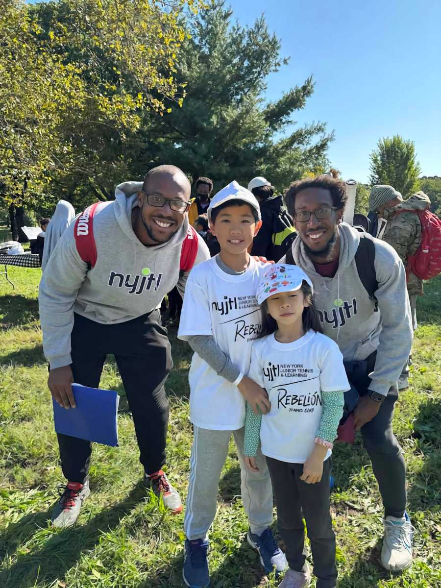 Brothers Christian Georges (left) and Gaetan Georges (right), with two of the students they coach at NYJTL.