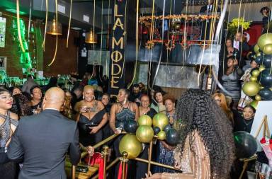 Family, friends and patrons of La'Mode BK Restaurant celebrating owner Amanda St. Louis-Brown’s birthday and six months in business.