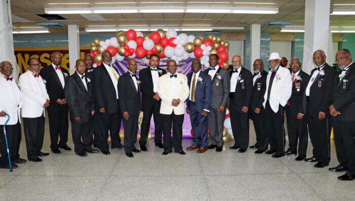 Rt. Hon. Errol Collins, most worshipful grand master (center with white jacket) with Executive Grand Councilors and Life members.