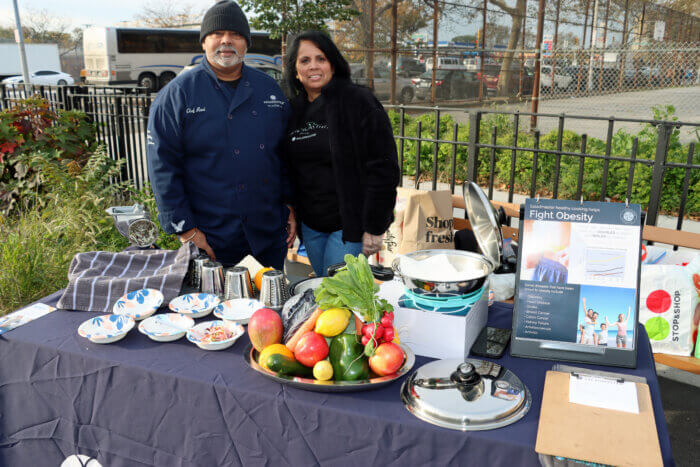 Trinidadians Ravi and Mera Samaroo, of Innovative Healthy Systems Salad Master, provide salad at the Walk.