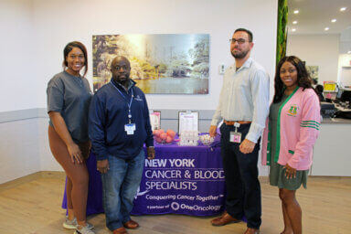 From left are volunteer Keylia Carter, Klein Dolcine, Michael Scanlon, and volunteer Quintasia Welch.