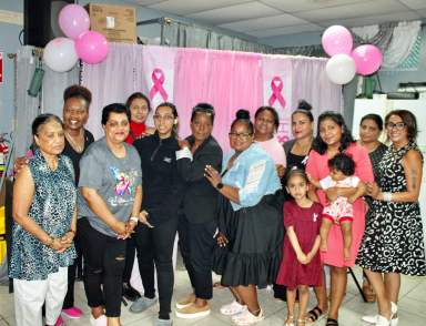 Survivors, thrivers and supporters gathered for a photo-op after fellowship session at the 6th Annual Queens Cancer Walk Candlelight Vigil at the Radha Krishna Mandir in Queens, on Oct. 28.