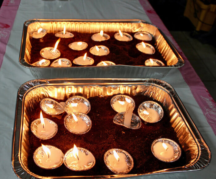 Candles were lit for family members and friends lost to cancer, during a vigil at the Radha Krishna Mandir in Queens.