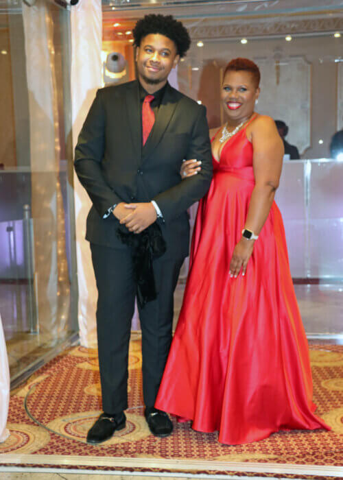 Daniel Roden, Jr. escorts his mom, Francine Ross-Roden in the reception hall.