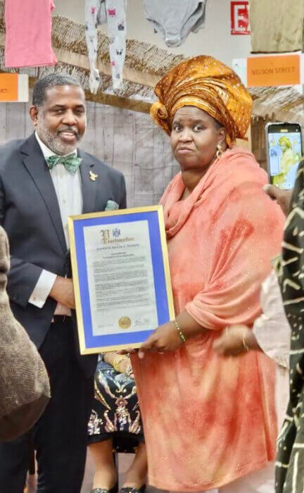 Sen. Kevin Parker, presents Glenda Cadogan, creator and founder of Yesterday's Children, with a Proclamation, on the 13th Anniversary, during a gala to honor seniors.