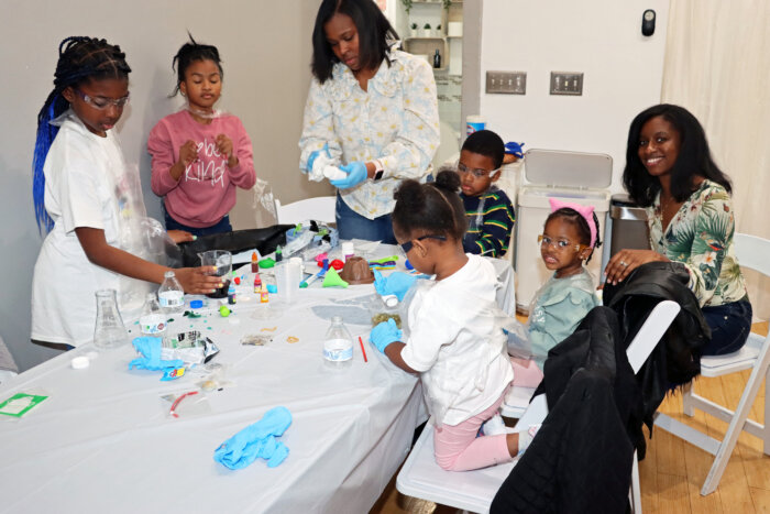 Teachers aid children on science project based on Dr. Ansha Clement's ‘Baby’s First Science: ABC.’