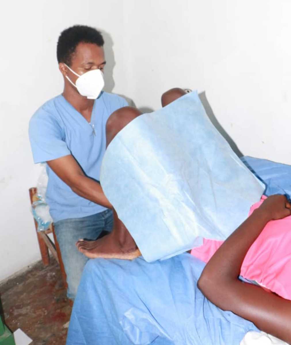 A trained medical staff of the organization examines a patient.