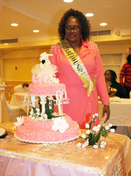 Irlene Jones-Brathwaite cuts her birthday cake.