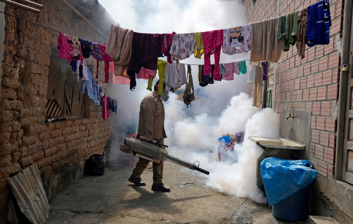 A health worker fumigates a home for mosquitos to help mitigate the spread of dengue in Caranavi, Bolivia, March 2, 2023. Dengue is sweeping across the Western Hemisphere in numbers not seen since record-keeping began more than four decades ago.