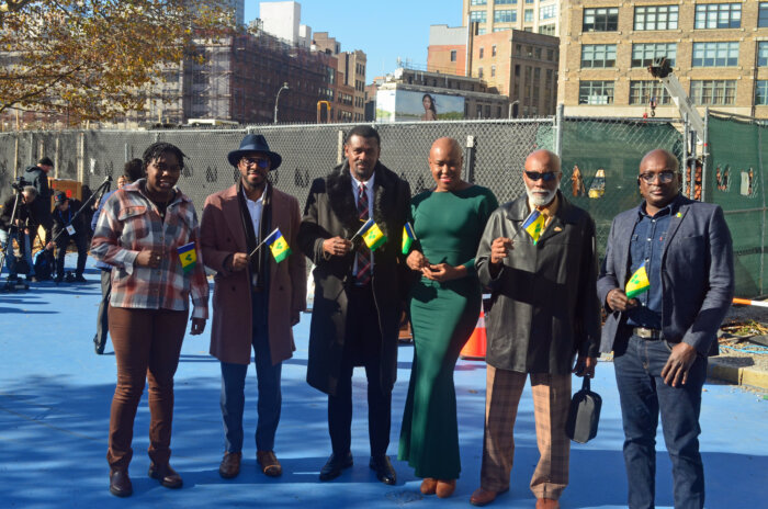 SVG Consul General Rondy "Luta" McIntosh, third from left, with Vincentian at unveiling ceremony.