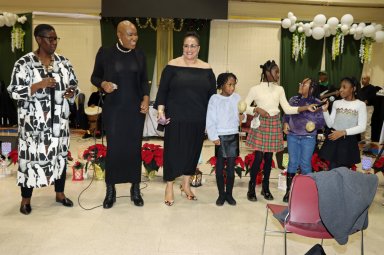 Children join "We Three Kings", from left: Sherill-Ann Mason-Haywood, Kamla Millwood and Annette Stowe.