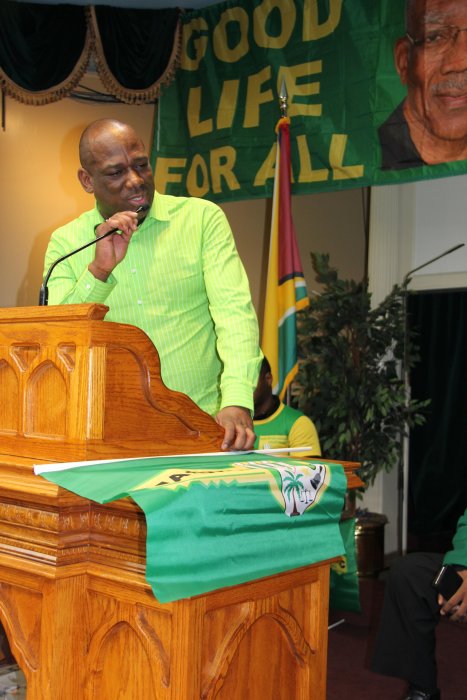 Rickford Burke, president of the Brooklyn-based Caribbean Guyana Institute for Democracy (CGID), addresses hundreds of Guyanese at a rally in Brooklyn early 2020.