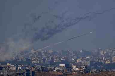 Rockets are fired toward Israel from the Gaza Strip, as seen from southern Israel, Friday, Dec. 1, 2023.