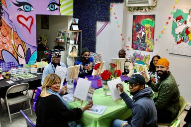 Anthony Springer, creative director, CEO, and founder of Twinsted N' Brushes, center back, welcomed members of the community to his 109-19 Rockaway Blvd., Ozone Park art space for a day of unity and painting, on MLK Day.
