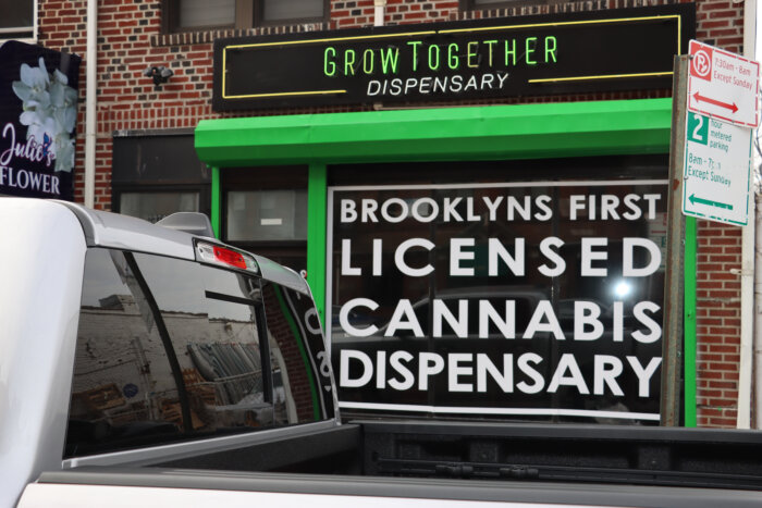 Signage outside "Grow Together" Brooklyn's first licensed cannabis dispensary.