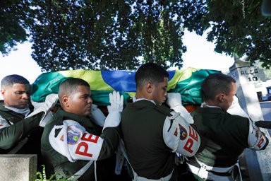 Members of the army police carry the coffin of former Brazilian soccer coach and player Mario Zagallo for his burial, at the São Joao Batista cemetery, in Rio de Janeiro, Brazil, Sunday, Jan. 7, 2024. Zagallo, who reached the World Cup final a record five times, winning four, as a player and then a coach with Brazil, died at the age of 92.