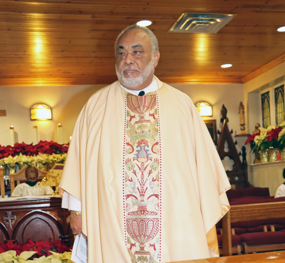 Fr. Rev. Cannon George L. Bonner delivers homily at the funeral service last month for Vincentian-born community worker Joseph Alexander "Alex" Hinds.