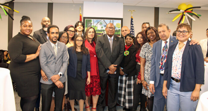 Consul General of Guyana to New York Ambassador Michael E. Brotherson, center, surrounded by his dedicated staff at a 54th Republic Day Observance at the Guyana Consulate in Manhattan, on Feb. 22.
