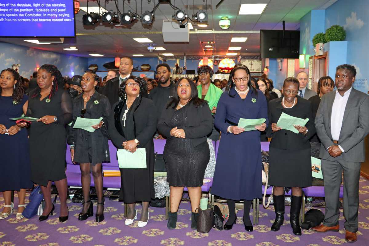 Family members of the late Alleyne DeRoche at the front pew.