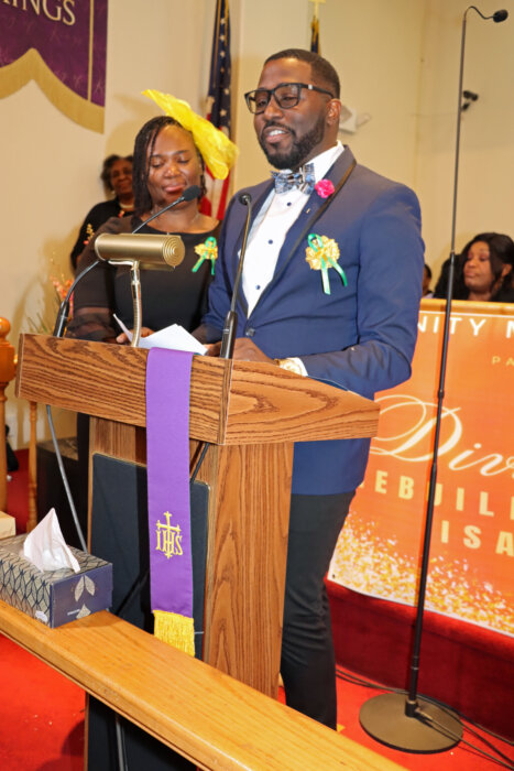 Pastor Michael Craigg, flanked by his wife Dr. Moya Rhoe-Craigg, eulogizes his mother.