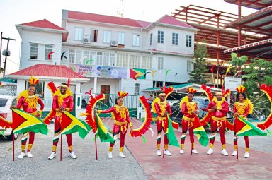 Members of the Guyana Ministry of Education costume band pose after a spectacular display in preparation for the 2024 Mashramani Road March competition on the streets of Georgetown, Guyana on Feb. 23.