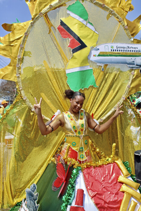 A 15-year-old student masquerading in the band "Surety in Unity for Prosperity" a Paul Burnette creation during the 2024 Mashramani Parade in Georgetown, Guyana.