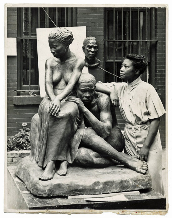 Sculptor Augusta Savage with her monument Realization (1936), which is missing today.
