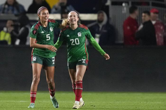 Mexico midfielder Mayra Pelayo-Bernal, right, celebrates her goal with defender Karen Luna during a CONCACAF Gold Cup women's soccer tournament match against the United States, Monday, Feb. 26, 2024, in Carson, Calif.