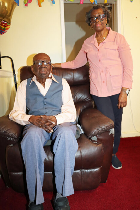 Centenarian Mitchinson ‘Mitchie’ James in his favorite chair on Sunday.