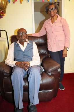 Centenarian Mitchinson ‘Mitchie’ James in his favorite chair on Sunday.