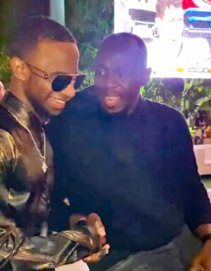 Nigy Boy and Olympic Champion Usain Bolt exchange pleasantries in the VIP Lounge at the Super Bowl "Rise & Toast" half time party in Miami.
