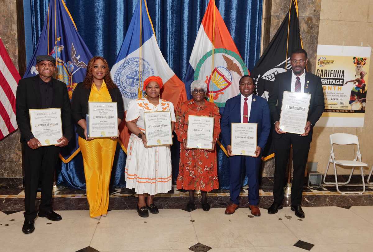 From left, Lou Ramos, Eudy Perez, Luz Soliz, Sara Mumez, Mejia, Cristian Guity and Hon. Rondy Mc Intosh, consul general of Saint Vincent and the Grenadines to the United States of America.