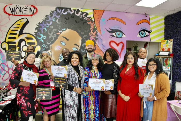 Award recipients and attendees pose at an International Women's Day event, hosted by Culture of Blessings, at Twisted N Brushes art gallery in Queens, on March 18. Front, from left, Aura de Alli, Sherry Williams, Chiomo LN Uzo-Udegbunam Ph.D, Bibi Alli, Michelle Babb, Dr. Ezinne C. Kalu, and Toshoy Phipps. Backrow, Anthony Springer, guest, partly hidden, Terrence Brummell, Japneet Singh, and Dr. Elvemuno Ajalie.