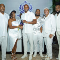 Jamaican Olympian Asafa Powell, who broke the 100 meters ten-second barrier 97 times, was honored with the 2024 Bleu & Bougie 'Superstar' Award. Elite Weekend Ambassador Talitha Smiley presented the award to Asafa. Looking on are members of the Elite Weekend executive team.