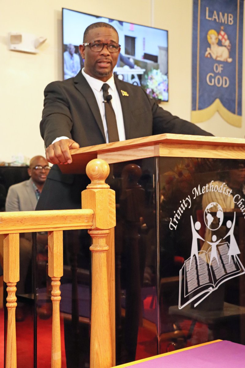 Pastor Derwin Grant delivers the sermon at the funeral service last month for beloved Vincentian community worker Denise Craigg.