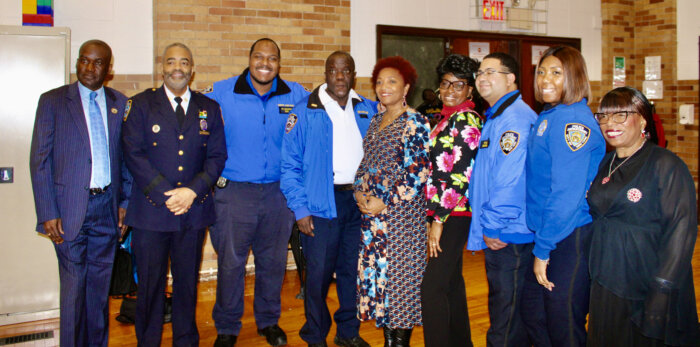 The NYPD officers join Councilmember Councilmember Mercedes Narcisse fifth from left, for a photo-op, at the March 9, 2nd Annual Valentine's Dinner in the auditorium of Holy Family Church in Canarsie, Brooklyn.