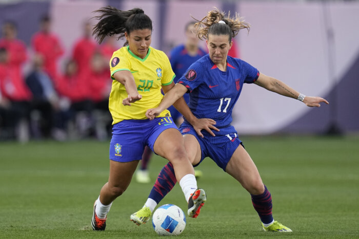 United States' Sam Coffey (17) battles Brazil's Duda (20) for the ball during the first half of the CONCACAF Gold Cup women's soccer tournament final match, Sunday, March 10, 2024, in San Diego.