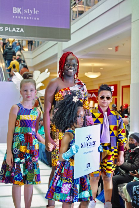 Shivenze Fashion creator with little models wearing African print outfits last Saturday, April 6, during a Kings Plaza mall event to kick-off Brooklyn Fashion week.
