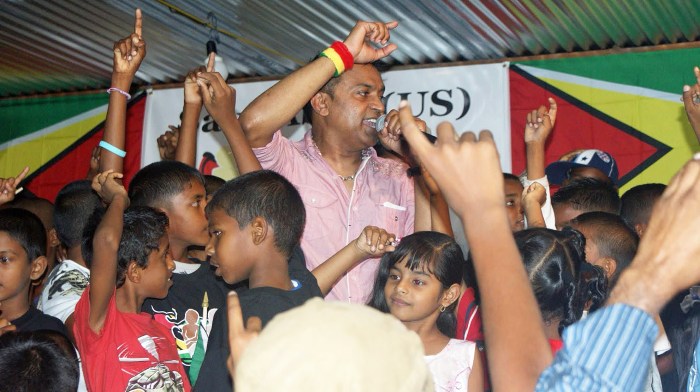 Terry Gajraj performing at their annual Christmas party for children of Save Abee School.