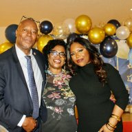 Captain Eric Bramwell, wife Grace, and daughter, Ericia, against a backdrop that says ‘Farewell,’ during a gathering on March 28, at the United Nations Headquarters, to wish the security officer a happy retirement after 36 1/2 years of service.