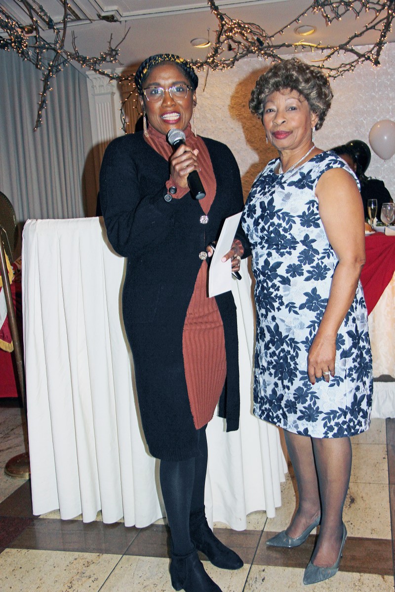 Rosslyn Taylor (left) receives the Dr. Jean Leon Award from Dr. Leon.